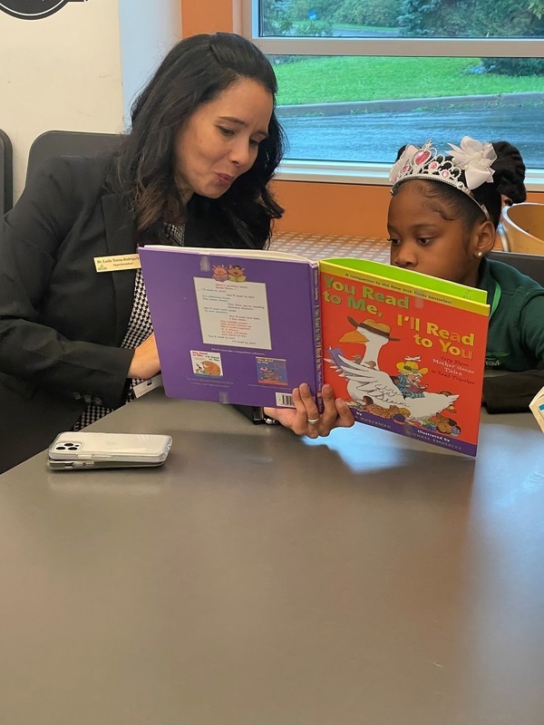 Superintendent Dr. Leslie Torres-Rodriguez Reads to a Second Grader at Annie Fisher STEM Magnet School